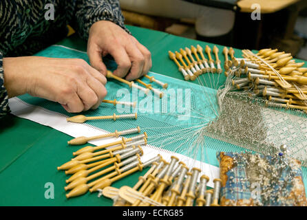 Close up of a woman doing bobbin lace making, a traditional craft, Bruges, Belgium, Europe Stock Photo