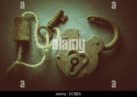Rusty old padlock and key. Stock Photo
