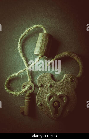 Vintage rusty padlock unlocked with key isolated on white background ...