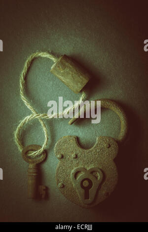 Vintage rusty padlock unlocked with key isolated on white background ...