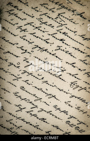 old handwritten text in german language from ca. 1900. grunge vintage paper background with vignette Stock Photo