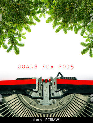 Old typewriter with sample text GOALS FOR 2015. Christmas tree twigs decoration Stock Photo