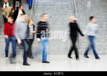 Motion Blur of People Walking on Stairs Stock Photo