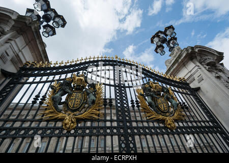 Buckingham Palace the official residence of Queen Elizabeth II and one of the major tourist destinations U.K. Entrance and main gate with lanterns Stock Photo