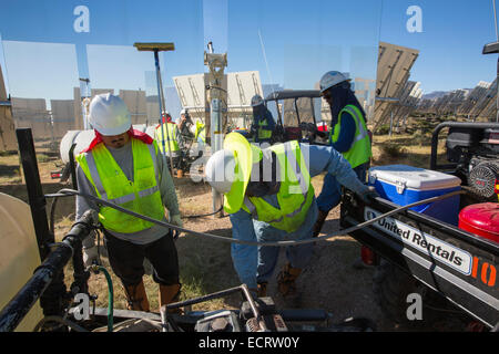 Cleaning heliostats at California's Ivanpah solar thermal power station, the largest solar thermal plant in the world. Stock Photo