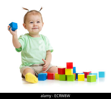 baby playing with colorful building blocks isolated on white Stock Photo