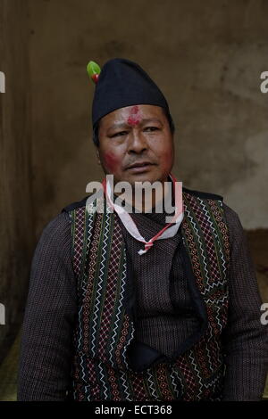 A Nepali man with Tilaka mark on his forehead wearing A Bhaad-gaaule Black Cap popular among Nepalis men, specially in Newari Community, Nepal Stock Photo