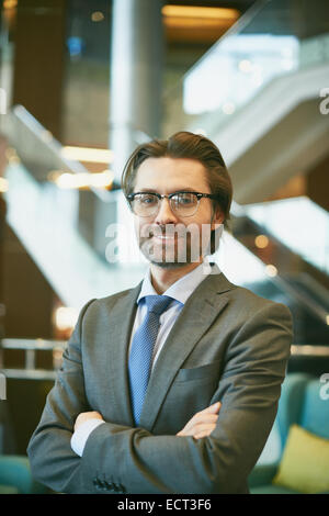 Mature boss looking at camera Stock Photo