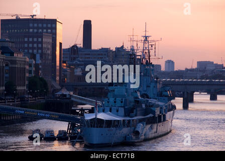 London 20 Aug 2013 : HMS Belfast moored on The River Thames at sunset Stock Photo