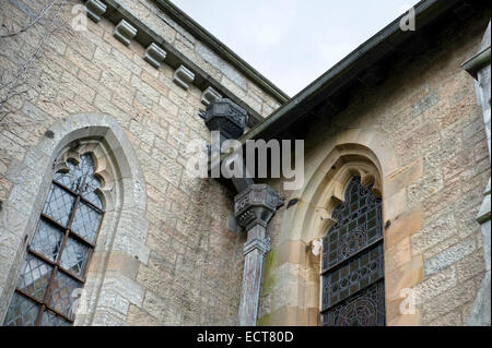 looking up to the dentil blocks beneath a string course of the chapel at Haddo House Stock Photo