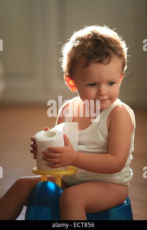 2 years old boy on his chamber pot. Stock Photo