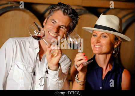 Tourism - Couple tasting wine in a cellar Stock Photo