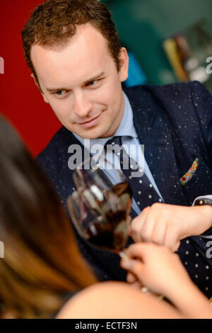 Young Couple Drinking Red Wine Stock Photo