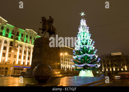 Moscow, Russia - December 15, 2011: Christmas - New Years tree near monument to prince Yury Dolgorukiy, founder of the city, on Stock Photo