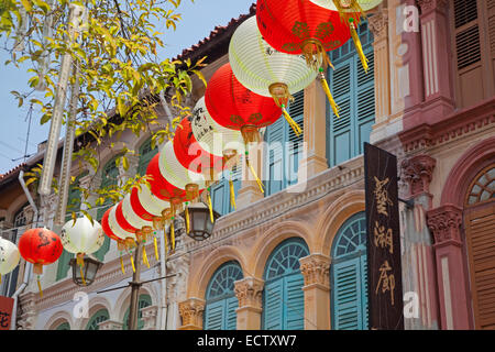 Colourful Chinese paper lanterns hanging in shopping street in the Chinatown neighbourhood of Singapore Stock Photo