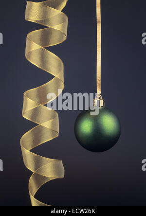 Single Christmas Bauble and gold Ribbon Stock Photo
