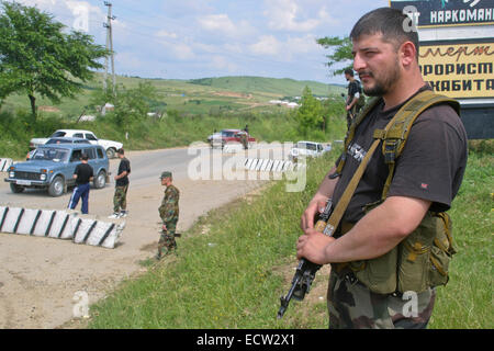 Members of the militia of Chechen leader Ramzan Kadyrov, the later president, at the entrance to the village of Tsentoroi, Chechnya, Russia. Stock Photo