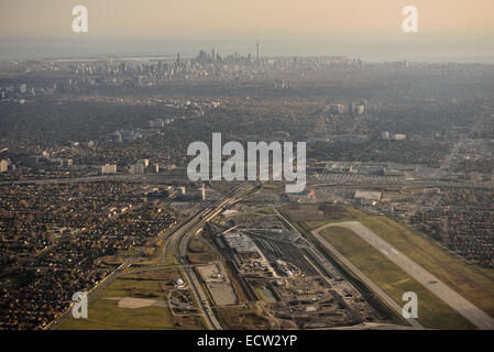 Aerial view of Downsview Airport and Yorkdale Shopping Centre in North York with Toronto city skyline of highrise towers Stock Photo