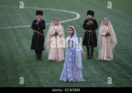 Members of the Chechen childrens' dance group Bashlam during a performance in the FC Terek football stadium in the Chechen capital Grozny, prior to a football match between Terek and FC Zenit from St Petersburg. Stock Photo