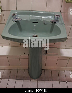 Classic 1970s 1980s green avocado bathroom suite Wash Hand Basin from England, Great Britain Stock Photo