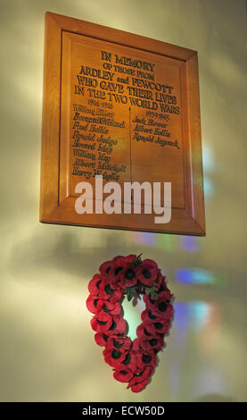 In memory of the Fallen plaque, St Marys Ardley, Oxfordshire, England, United Kingdom. With remembrance poppies Stock Photo