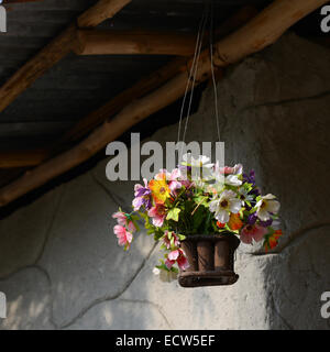 fake flower varicolored in hanging basket for decorative home Stock Photo