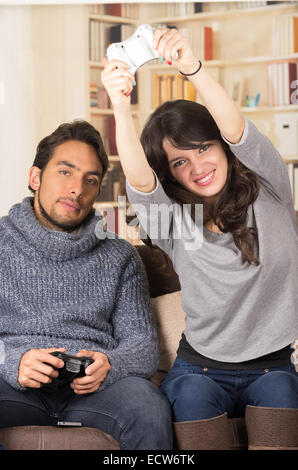 young cute couple playing video games Stock Photo