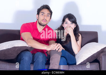 young attractive couple watching movie at home Stock Photo