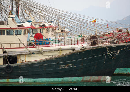 Fleet Of Commercial Fishing Boats Laid-Up On Cheung Chau Island, Hong Kong. Stock Photo