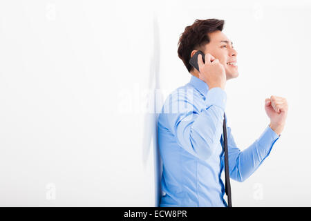 successful businessman talking on the phone in office Stock Photo
