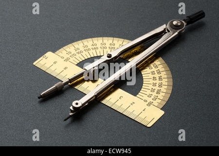 Pair of compasses and protractor isolated on white Stock Photo