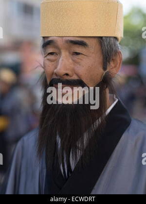 Okinawan man in traditional costume Ryukyu Mura, historical village ...