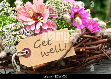 English card with pink flowers and get well soon text Stock Photo