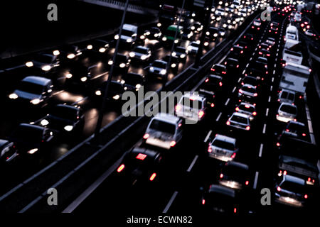 car lights on a highway by night Stock Photo