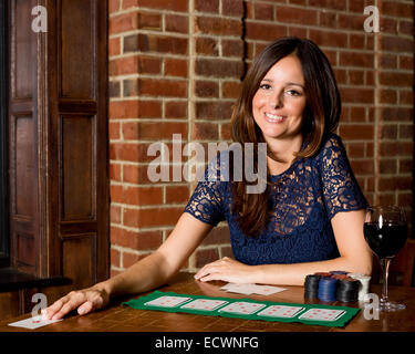 young woman playing poker. Stock Photo
