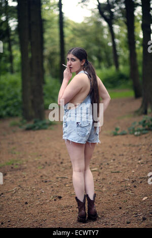 Backwood hill billy girl smoking a cigarette           16th July 2014 Stock Photo