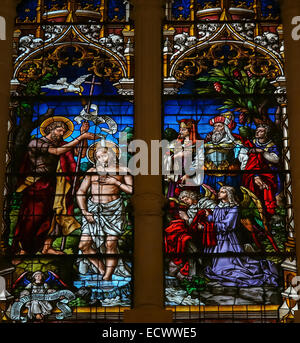 Stained glass window depicting the Baptism of Jesus by Saint John in the cathedral of Burgos Stock Photo