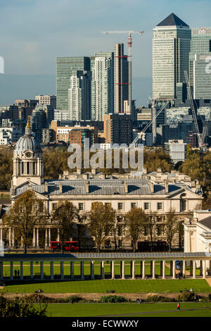 The Old Royal Naval College, Greenwich, London behind which is the skyscrapers of Canary Wharf. Stock Photo