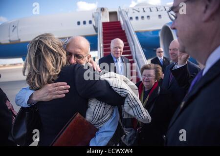 USAID contractor Alan Gross, imprisoned in Cuba for five years, is greeted after a flight back from Cuba following his release December 17, 2014 at Andrews Air Force Base in Maryland. Stock Photo