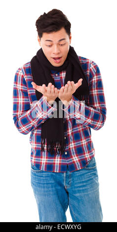 surprised  young man looking his hands Stock Photo