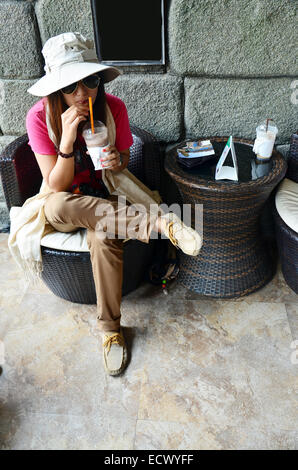 Thai woman drink coffee Stock Photo