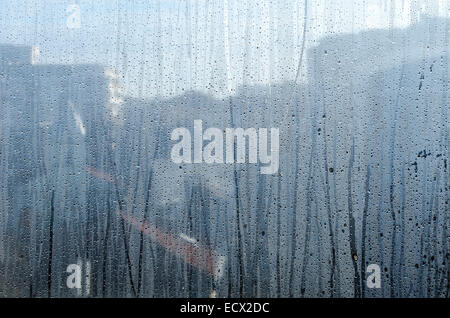 Closeup of natural water drop on glass background Stock Photo