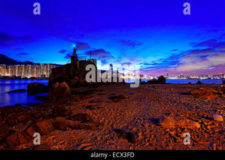 Hong Kong Sunset, Yau Tong Lei Yue Mun water bay and lighthouse Stock Photo