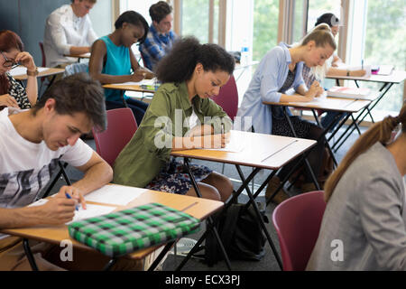 University students taking exam in classroom Stock Photo