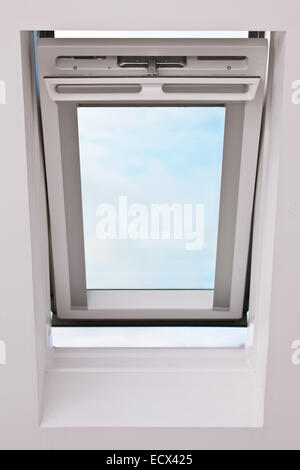 A modern skylight in an attic room Stock Photo