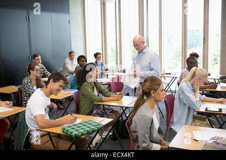 University students receiving test results from professor Stock Photo