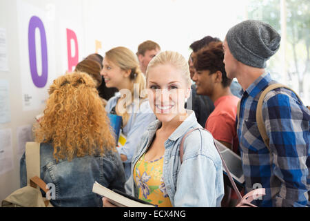 Smiling female student looking at camera Stock Photo