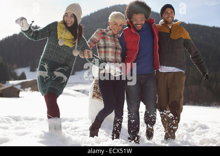 Friends playing in snow Stock Photo