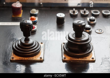 Two analog joysticks on a board expressions for operating a machine Stock Photo