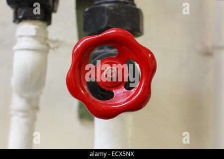 A red valve on a cooling system Stock Photo
